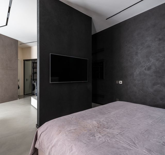 Wände in einem Loft bekommen durch Spachteltechnik Betonoptik